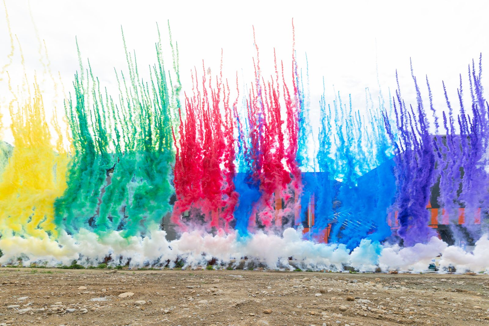 Colored daytime fireworks outside the plant